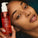 This image features a person holding a bottle of Radiance Cleanser, a pore-refining cleansing oil. The product is highlighted as being rich in Vitamin C, azelaic acid, and dragon fruit oil. The individual’s glowing, smooth complexion emphasises the cleanser’s ability to deeply cleanse and refine pores, leaving the skin radiant and refreshed.